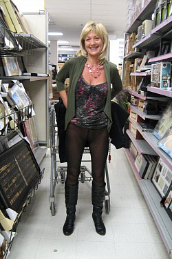 Candid pics of mature lady showing her black pantyhose in a public place